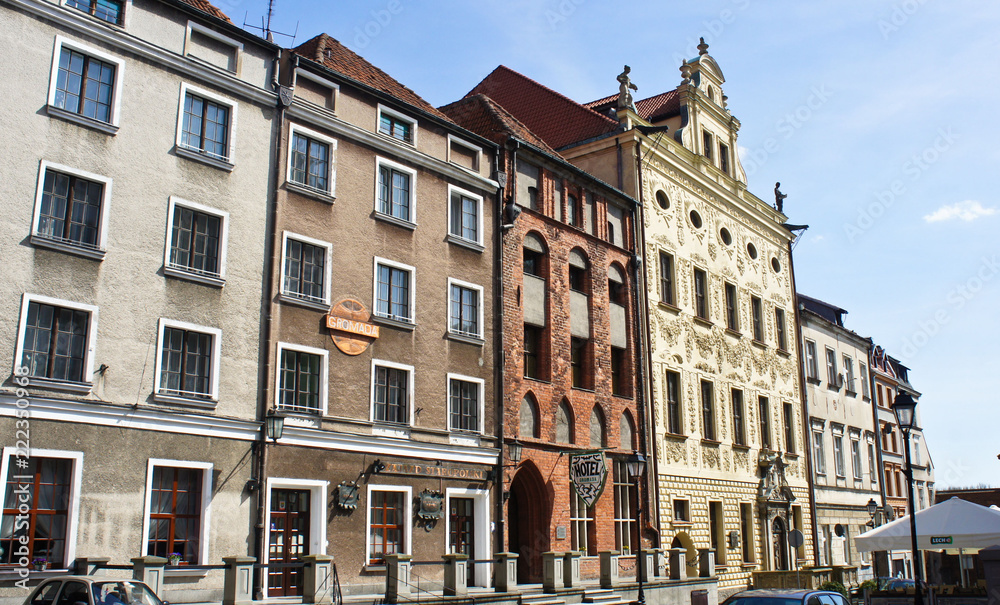 Torun, Poland - 04/19/2014 - street in old town with colorful buildings, sunny day