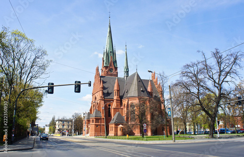 View of Church of St. Catherine, historic catholic temple, sunny day, Torun, Poland