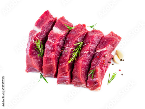 Raw meat, beef steak with seasoning on white background, top view