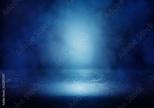 Background of an empty room with smoke and neon light. Dark blue abstract background