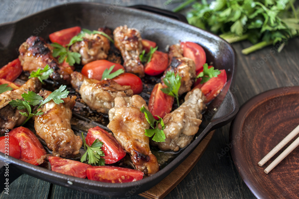 Grilled chicken wings with sesame seeds on a plate Grilled chicken wings with sesame seeds on a plate