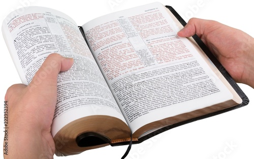 Hands Holding an Open Bible