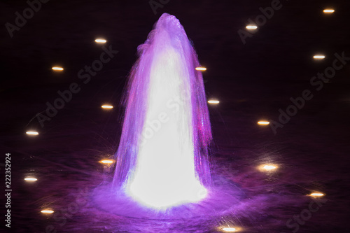 A purple fountain with some lamps around it © Lisa Mar