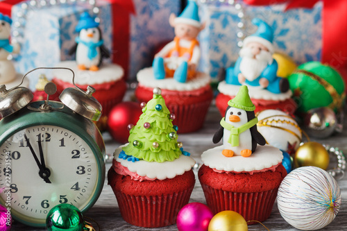 Christmas cupcakes with colored decorations, soft focus background © lisssbetha