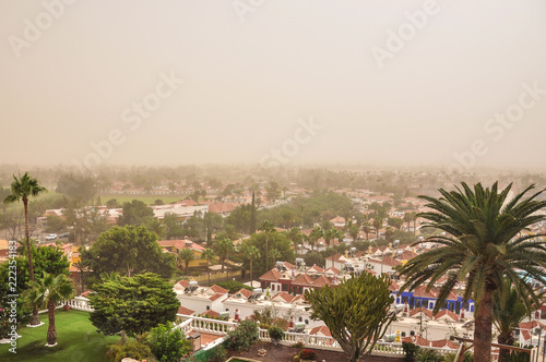 Town of Maspalomas during severe dust storm caused by turbulent Atlantic hurragan Helene. Calima, wind of Africa brings the sand from Sahara desert. Summer in Gran Canaria, Spain © michalrosak