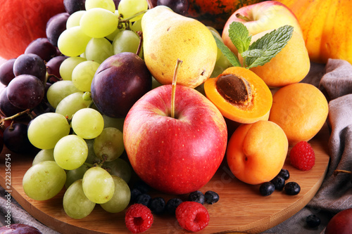 Fresh summer fruits with apple  grapes  berries  pear and apricot