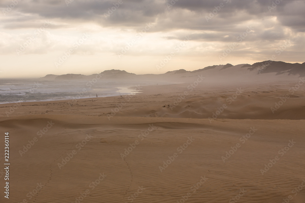 Sand Dunes in Kenton and a Fisherman