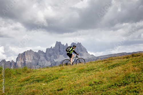 Cyclist pedal alone in the mountains.