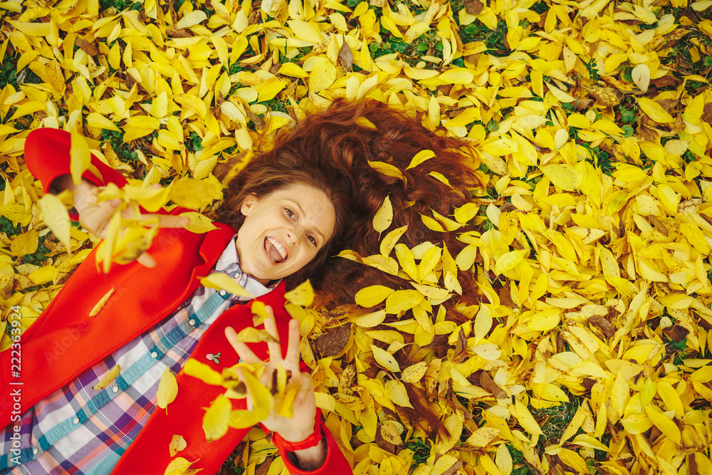 Young beautiful lady surrounded autumn leaves Young beautiful lady surrounded autumn leaves