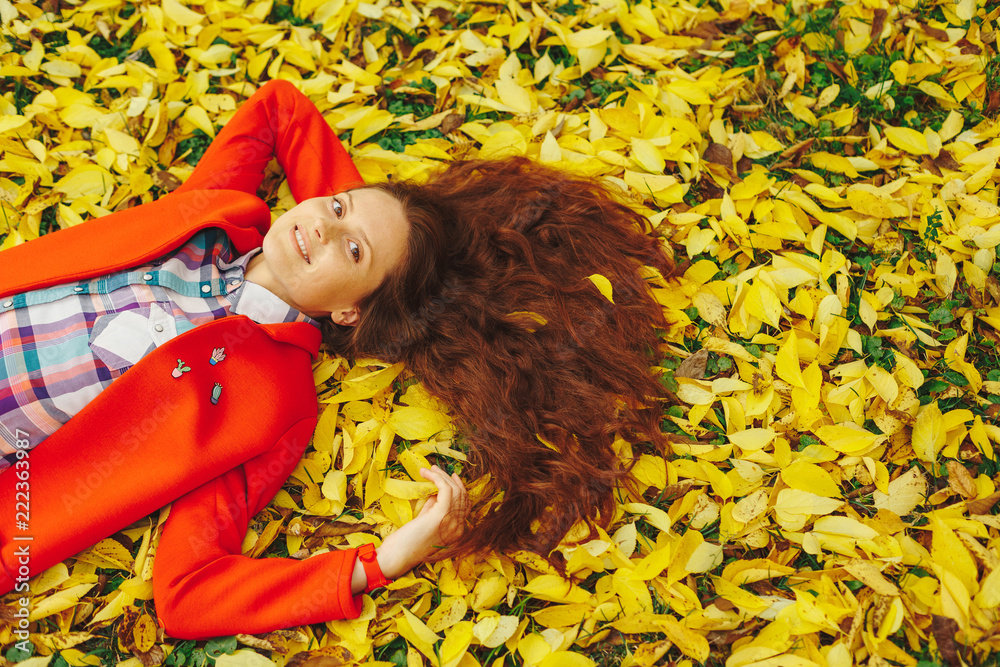 Young beautiful lady surrounded autumn leaves Young beautiful lady surrounded autumn leaves