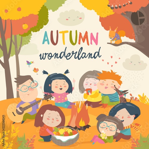 Cute friends sitting around bonfire in autumnal forest