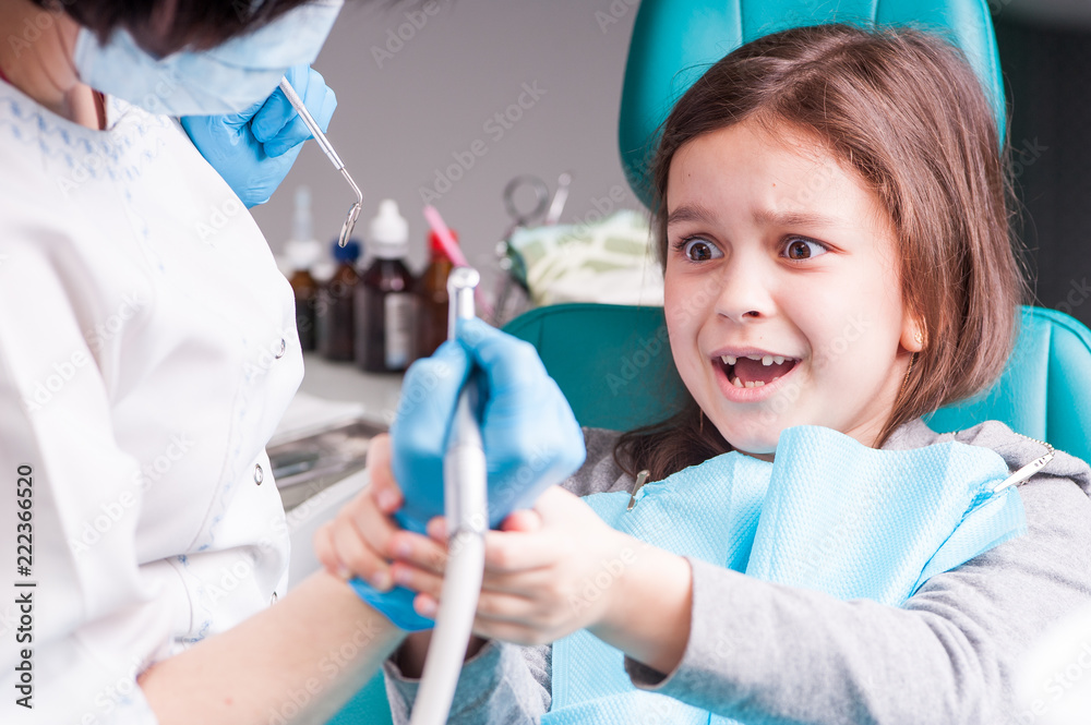 A child at a dentist's reception. Repair of teeth close-up. Children's dentistry