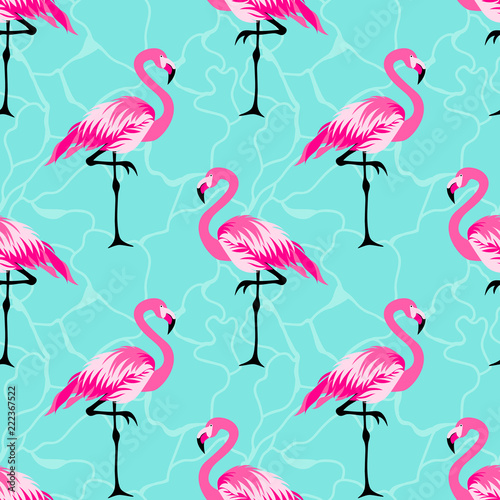 Seamless pattern with pink cute flamingo on a blue background photo