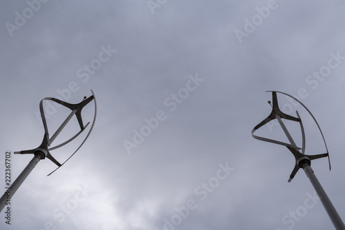 Two wind power generator windmills for clean renewable energy against global warming and climate change