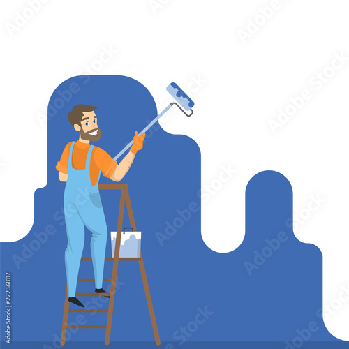 Worker painting the wall with blue paint
