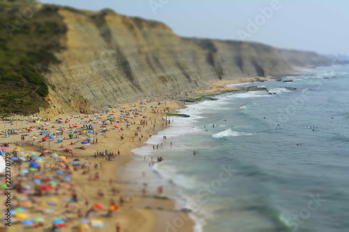 Aerial View Of People Relaxing On Beach In Portugal
