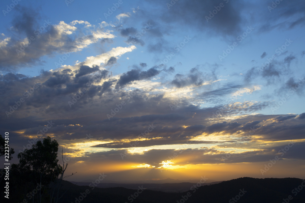 Beautiful sun set and clouds over the mountain range