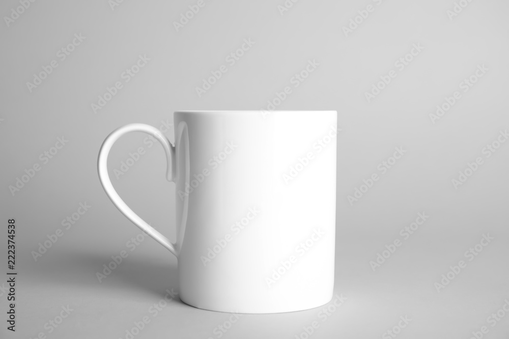 Obraz premium Ceramic cup on light background. Mock up for design
