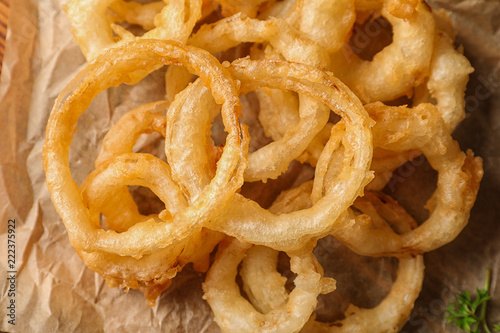 Homemade delicious golden breaded and deep fried crispy onion rings, closeup