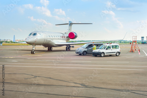 Airplane and cars at runway © joyt