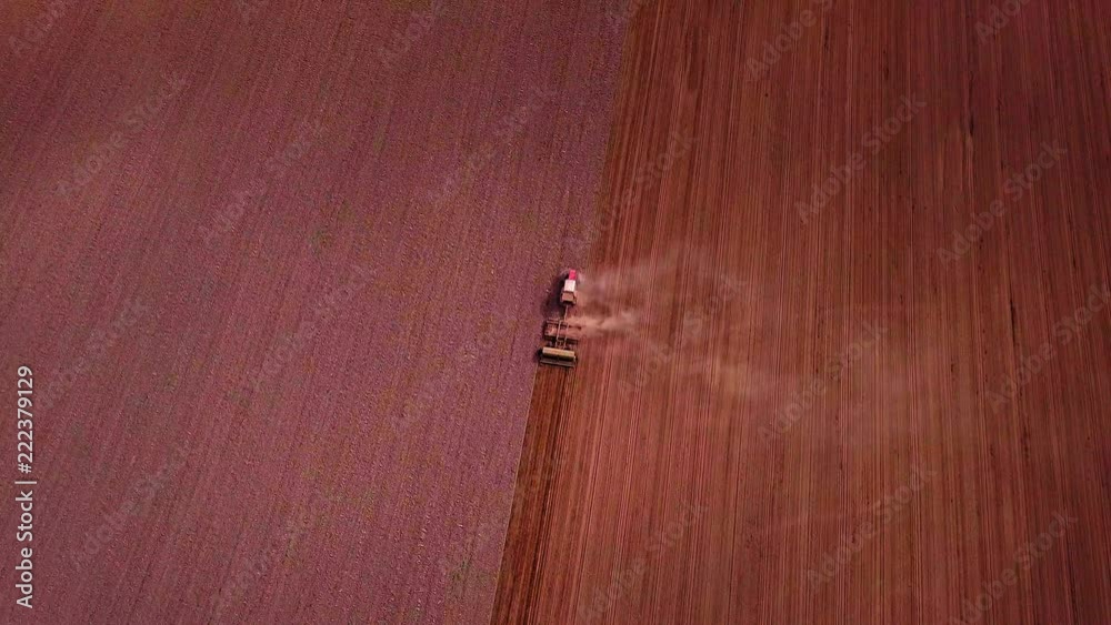 4k AERIAL: Tractor with the seeder sows the grain on field. 3840x2160, 30fps. 4k AERIAL: Tractor with the seeder sows the grain on field. 3840x2160, 30fps.