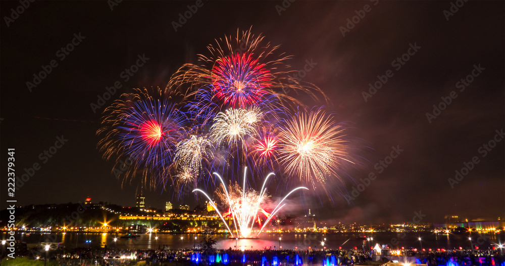 Blue, red, and white fireworks during a summer festival in Quebec City, Canada. Blue, red, and white fireworks during a summer festival in Quebec City, Canada.