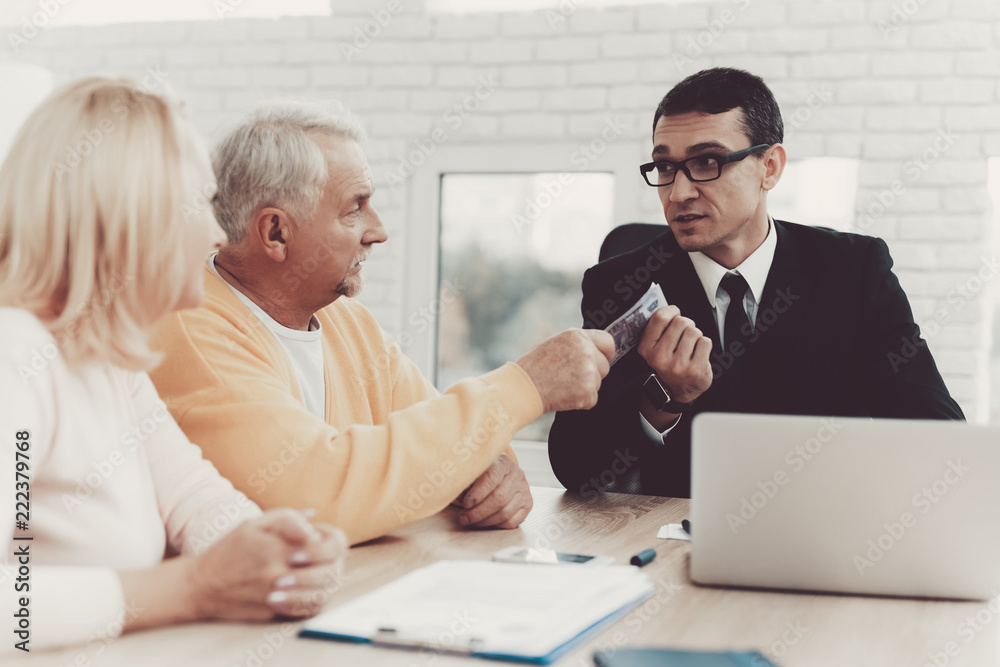 Fototapeta premium Old Man and Woman Visiting Young Lawyer in Office.
