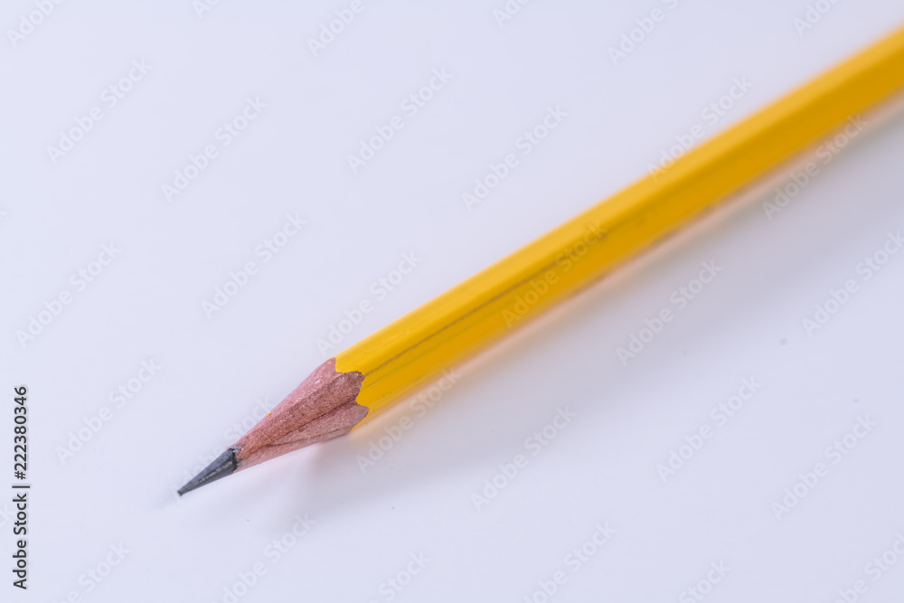 Single isolated yellow lead graphite pencil with a white background Single isolated yellow lead graphite pencil with a white background
