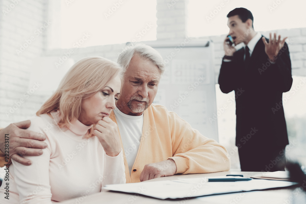 Old Man and Woman Visiting Young Lawyer in Office. Old Man and Woman Visiting Young Lawyer in Office.