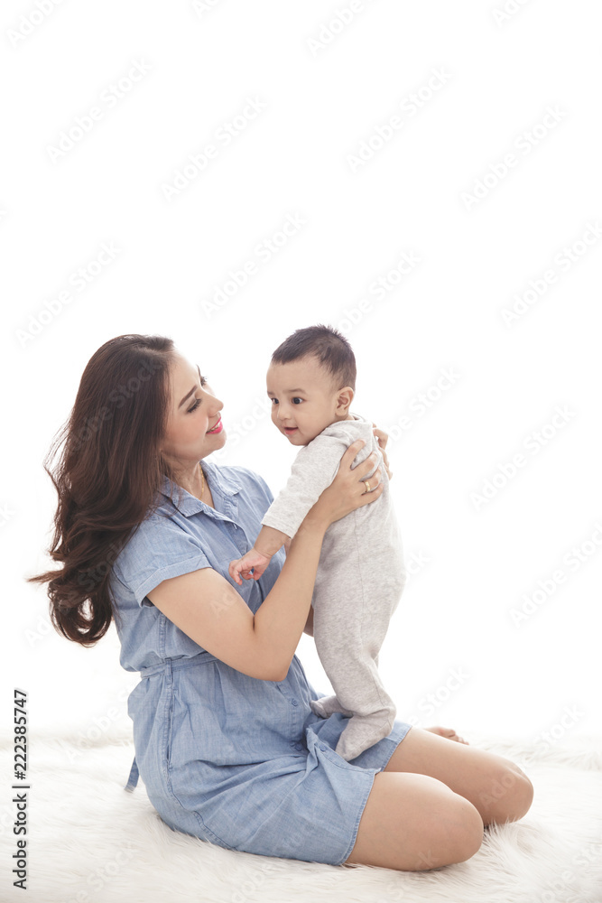 beautiful mom playing with her cute son