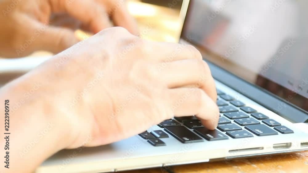 hands typing on laptop keyboard hands typing on laptop keyboard