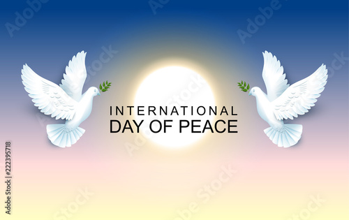 International Day of Peace pair of pigeons hold an olive branch