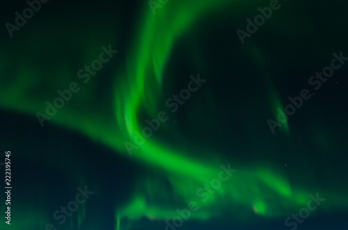 Aurora, Northern lights in the winter in the sky. © Moroshka