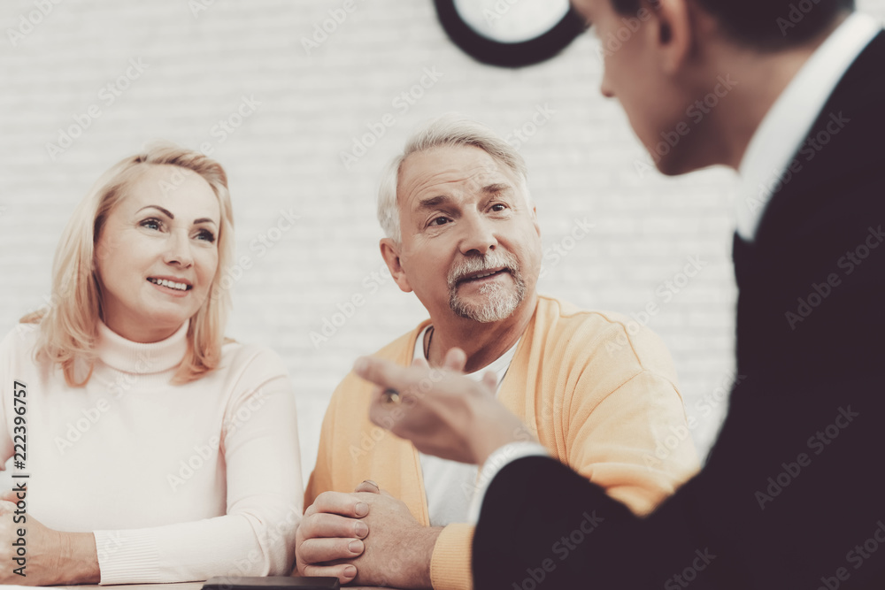 Old Man and Woman Visiting Young Lawyer in Office. Old Man and Woman Visiting Young Lawyer in Office.