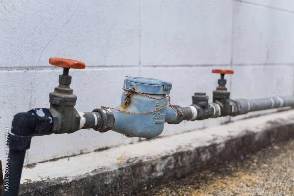 Brass valves and water meter in house for water supply system concept