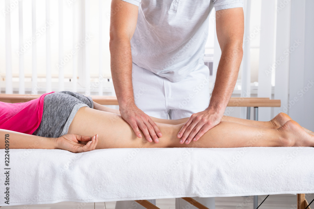 Fototapeta premium Female Patient Receiving Massage By Therapist