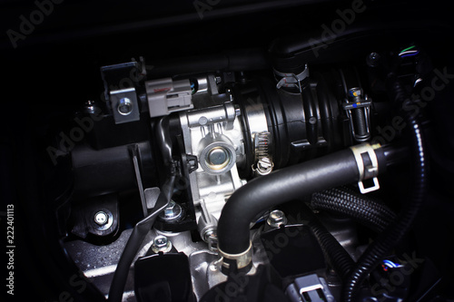 Throttle body installed in gasoline part engine system of car, automotive part concept. © BLKstudio