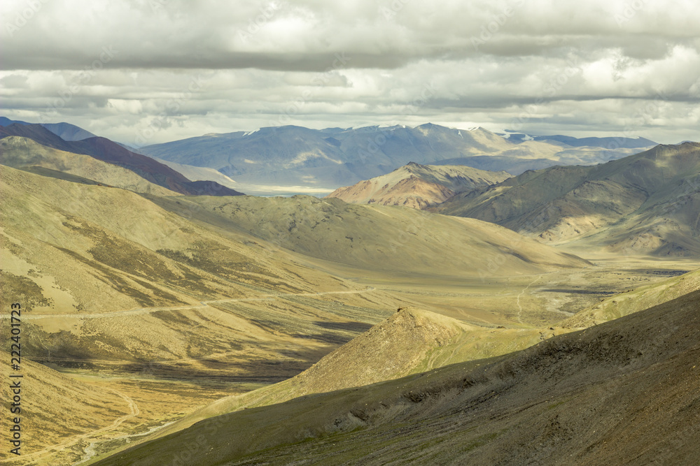 grandiose mountain valley with low dark sky grandiose mountain valley with low dark sky
