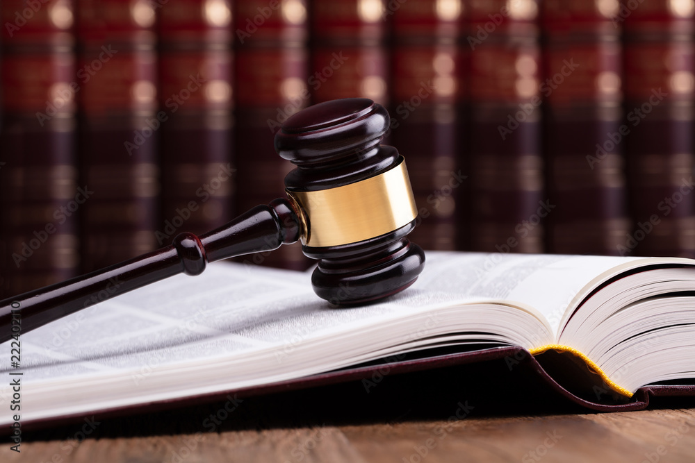 Wooden Gavel And Open Law Book Wooden Gavel And Open Law Book