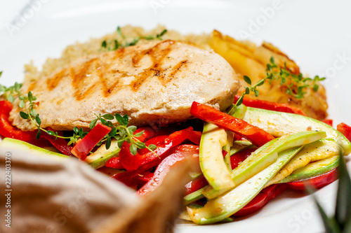 Plate of grilled chicken with vegetables