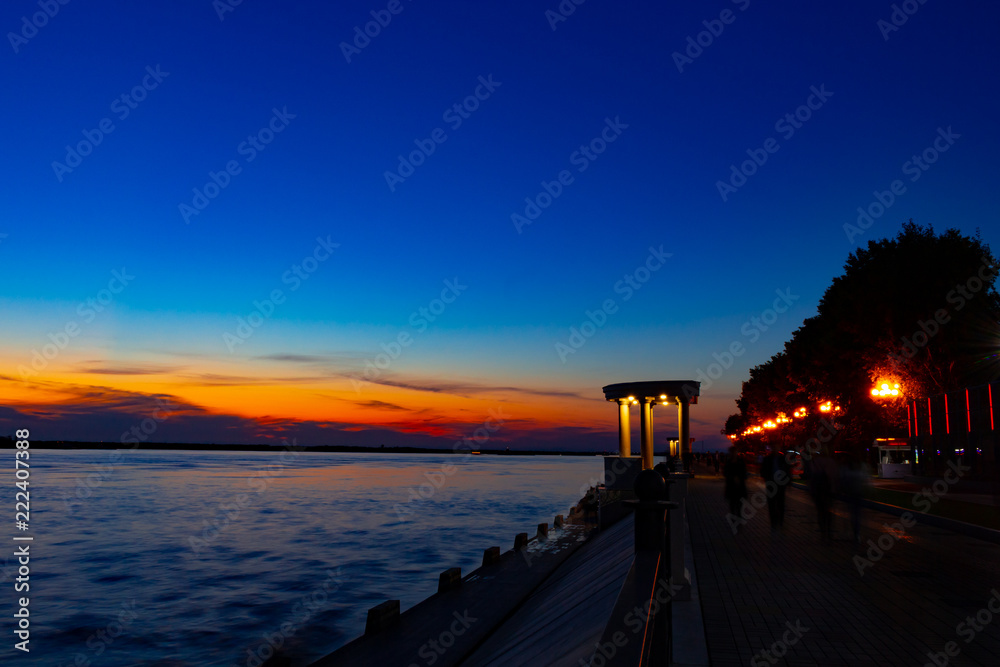 Sunset on the embankment of the Amur river in Khabarovsk. Russia.
