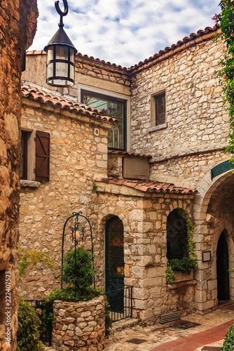Fototapeta Naklejka Na Ścianę i Meble -  Old buildings and narrow cobblestone streets in a picturesque medieval city of Eze Village in South of France along Mediterranean Sea