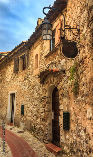 Old buildings and narrow cobblestone streets in a picturesque medieval city of Eze Village in South of France along Mediterranean Sea
