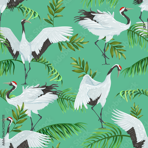 seamless pattern with cranes and palm leaves
