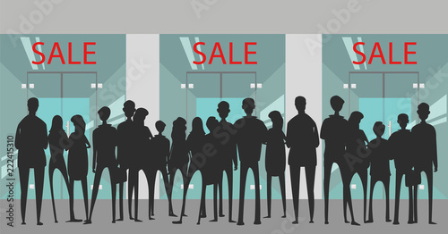 a crowd of people on sale. silhouette of the crowd on the background of the shop window