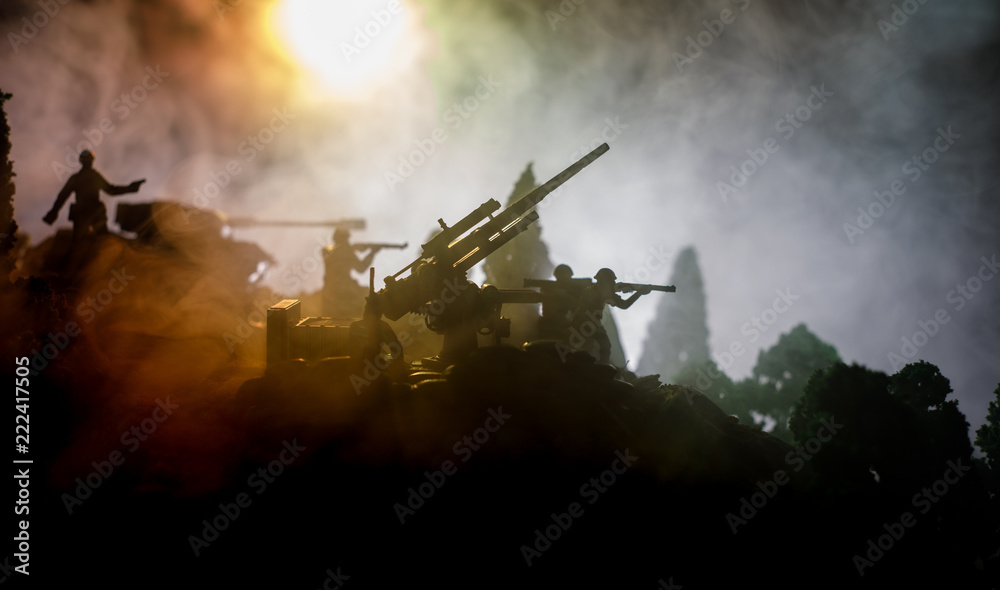 War Concept. Military silhouettes fighting scene on war fog sky background, World War Soldiers Silhouettes Below Cloudy Skyline At night. Attack scene. Selective focus Tanks battle. Decoration