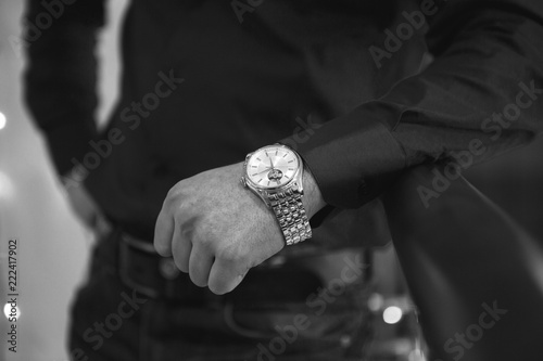 closeup designer watch on businessman hand
