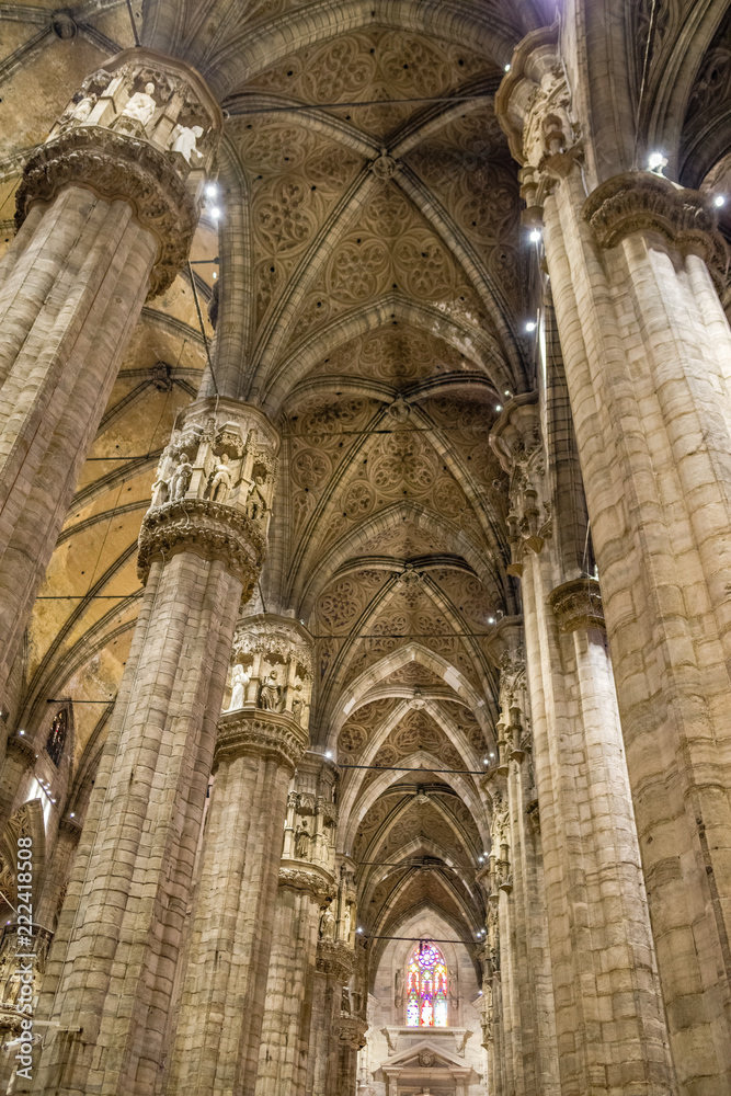 Vertical: Columns, ceiling, vaults, stainglass windows, alters of interior of the Duomo di Milano Vertical: Columns, ceiling, vaults, stainglass windows, alters of interior of the Duomo di Milano