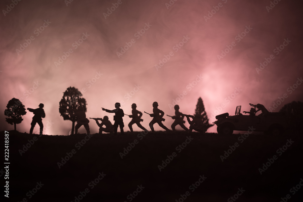 War Concept. Military silhouettes fighting scene on war fog sky background, World War German Tanks Silhouettes Below Cloudy Skyline At night. Attack scene. Armored vehicles.