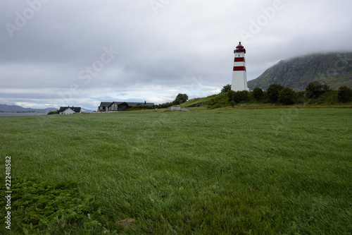 Alnes Lighthouse ,old and famous building ,established in 1852 to guide fishing boats  to the harbor of the fishing community of Alnes, More og Romsdal county, Norway.